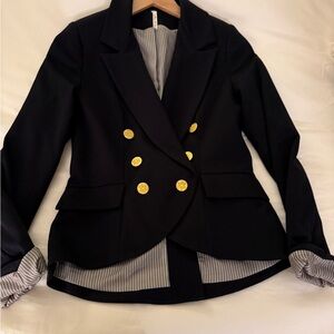 Navy blazer with silk striped lining. May cuff sleeves or not.